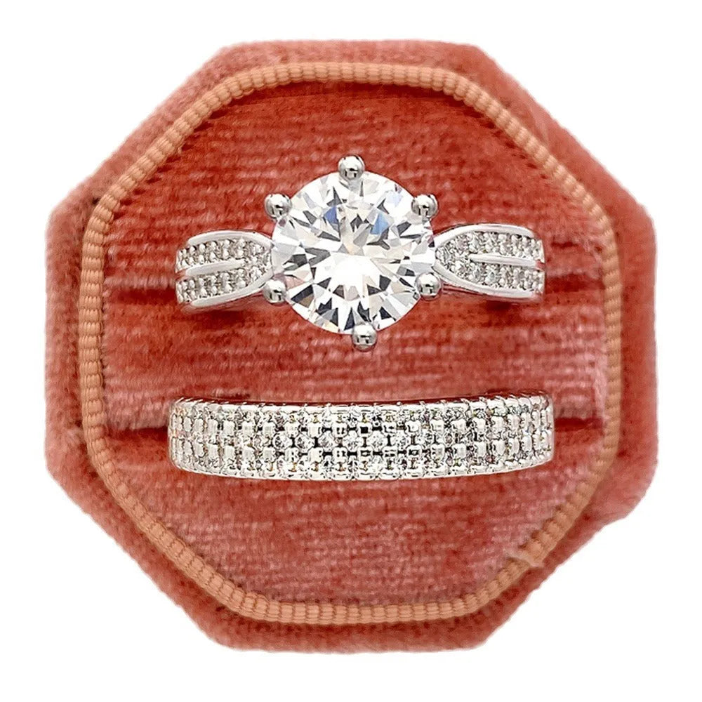 White gold colour alloy geometric wedding ring bracelet with round detail on a hand.