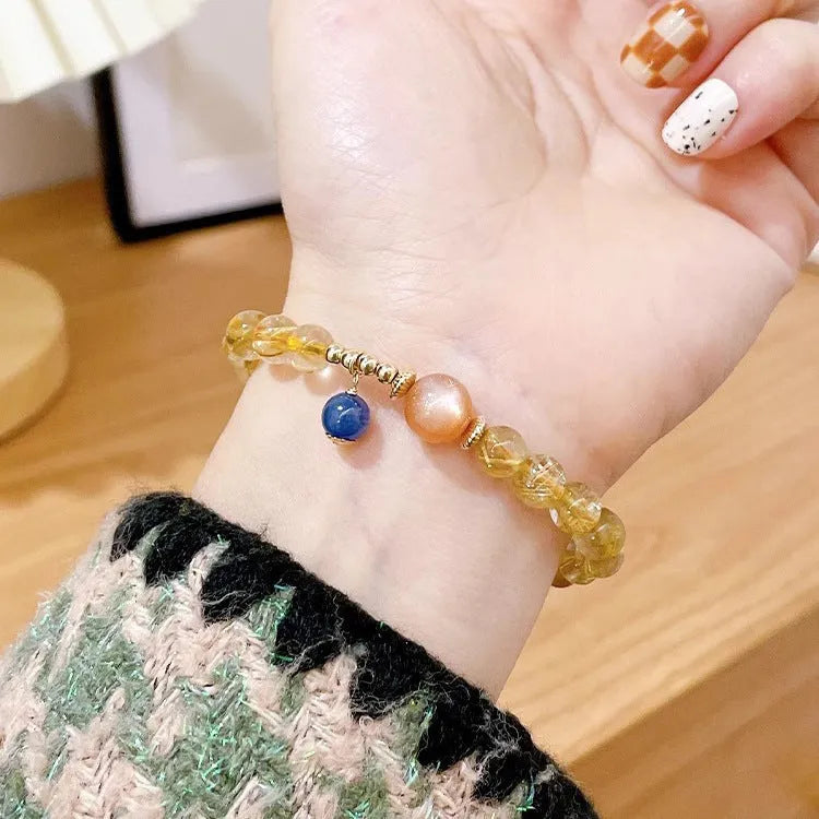 Women's gold rutilated quartz sunstone crystal bracelet with diamond-shaped beads