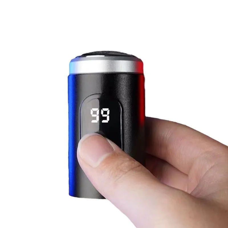 Black USB rechargeable mini shaver with cleaning brush and cable on a white background.