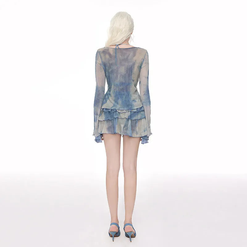 Women's blooming blue long-sleeved swim blouse with steel support and matching briefs on a hanger.