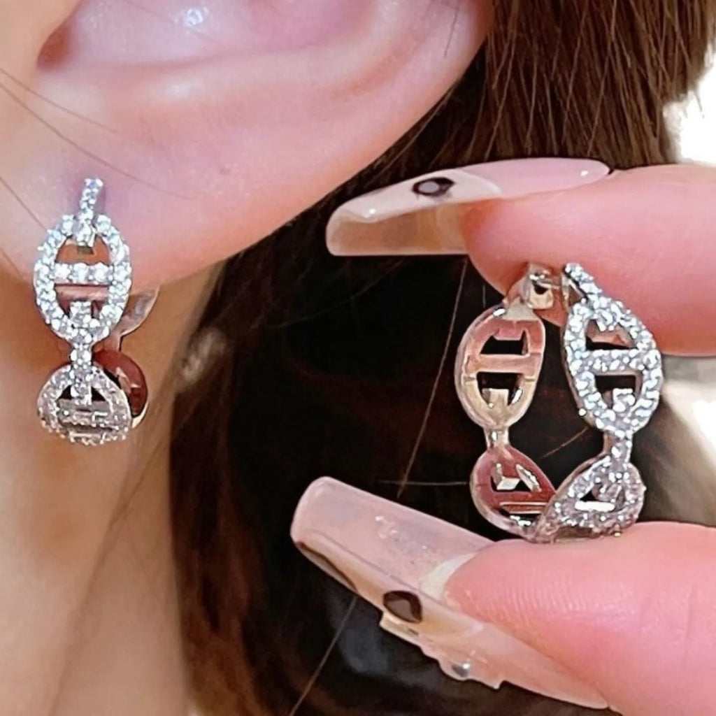 A pair of women's casual earrings with a thick gold-plated finish, shown in silver, gold, and rose gold colour options.