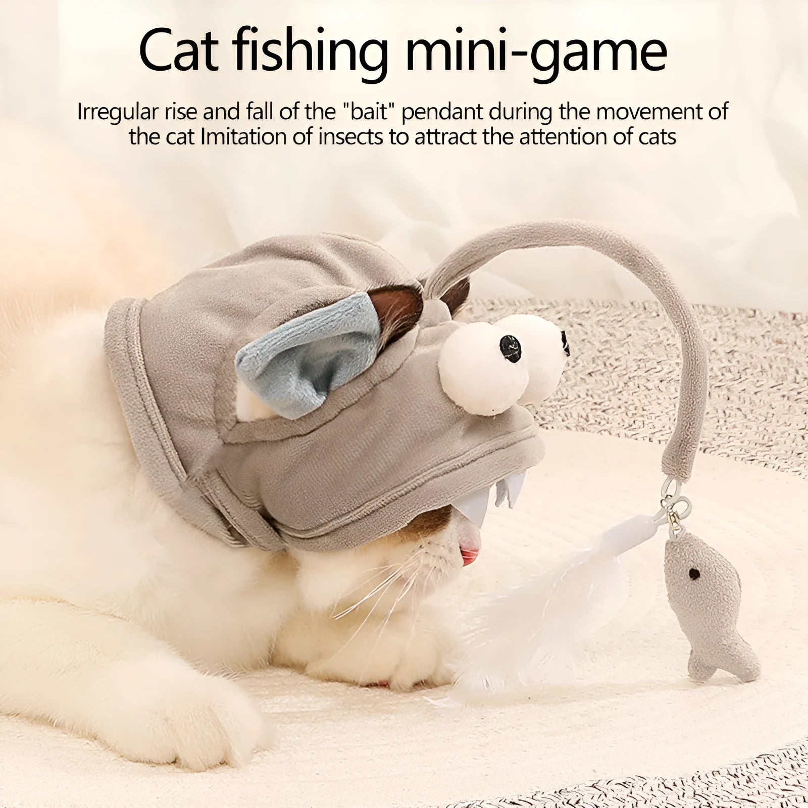 Grey cat teaser toy with adjustable headband, feather decoration, and big eye fish design