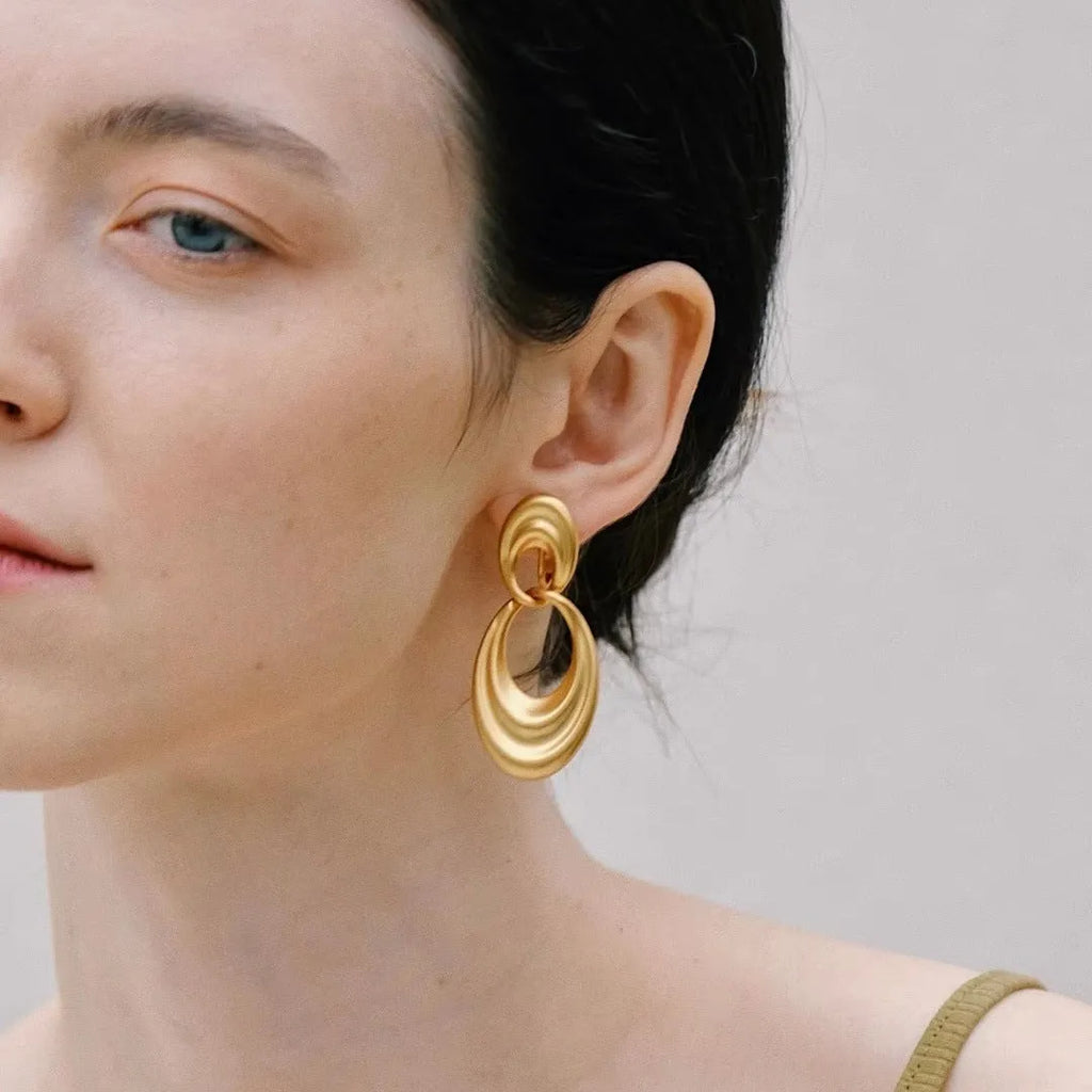 French retro style copper earrings with a U-shaped double circle design in a gold and quicksand finish.