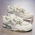 Men's low-top white and beige board shoes with a soft rubber sole and mesh lining.