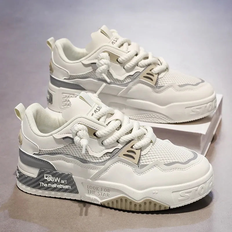 Men's low-top white and beige board shoes with a soft rubber sole and mesh lining.