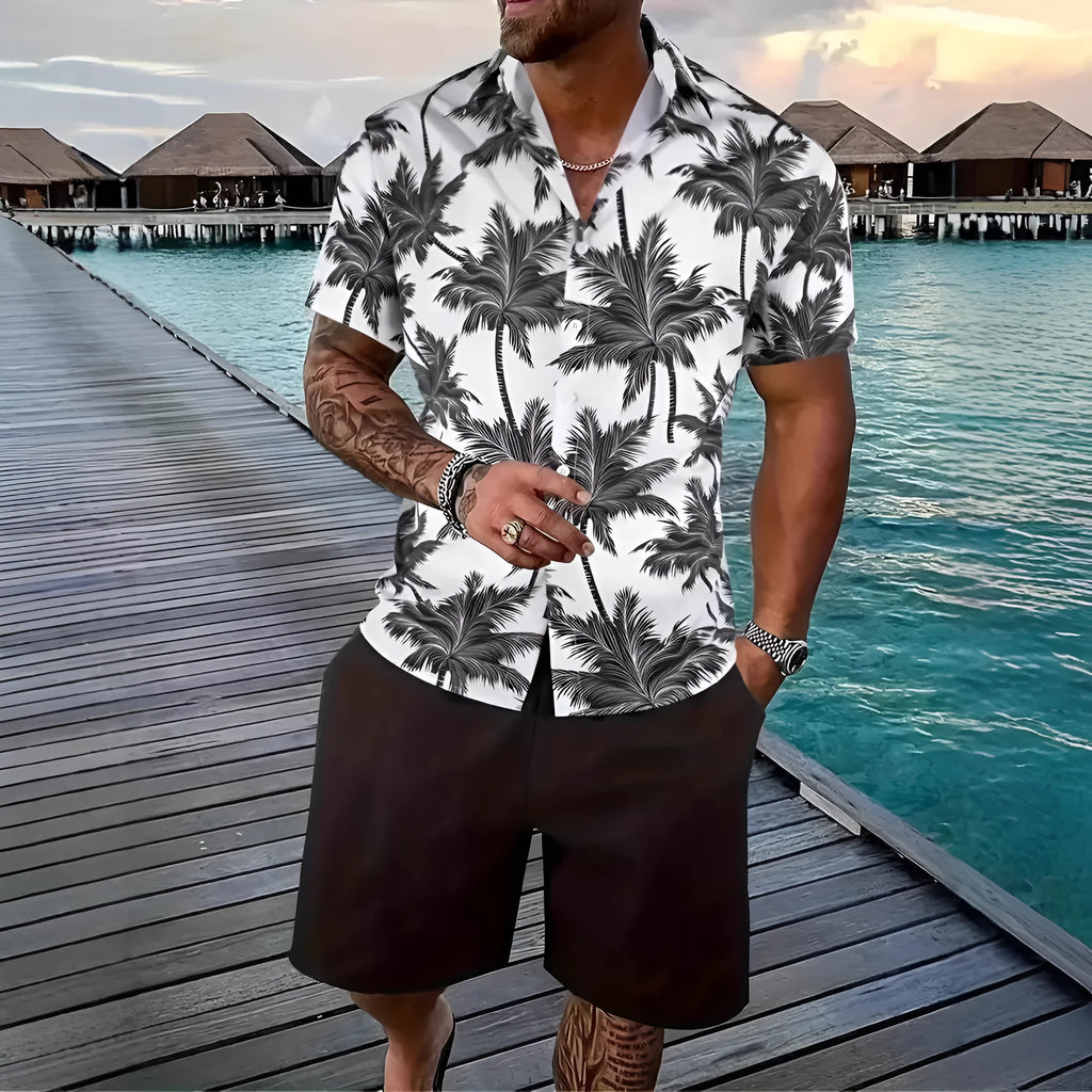 Man wearing a short sleeve Hawaii print shirt and matching shorts from the men's casual suit set.