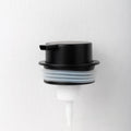 Foam pump for facial cleanser with large hand-push head in gold finish