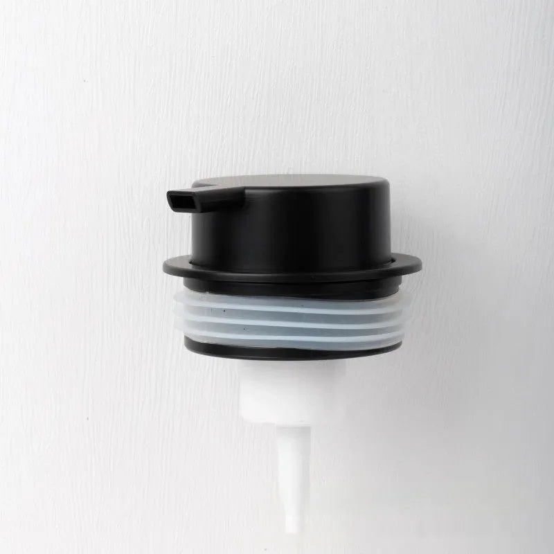 Foam pump for facial cleanser with large hand-push head in gold finish
