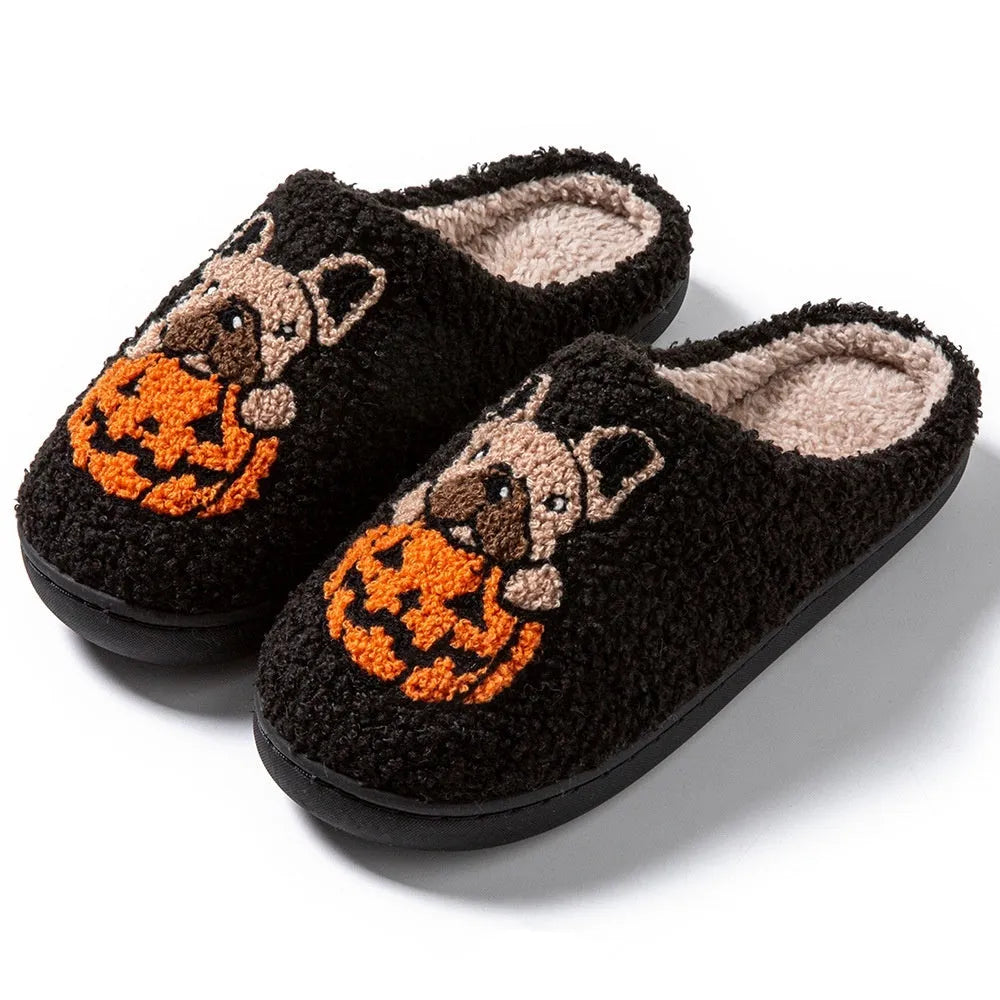 Black and white Halloween plush slippers with pumpkin design and non-slip rubber soles