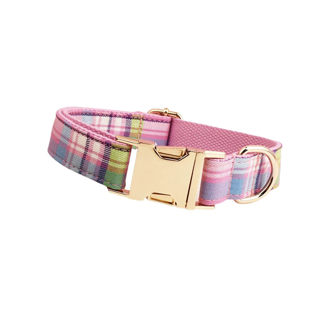 Four-piece dog accessory set with collar, leash, vest and decorative bow in cloth construction