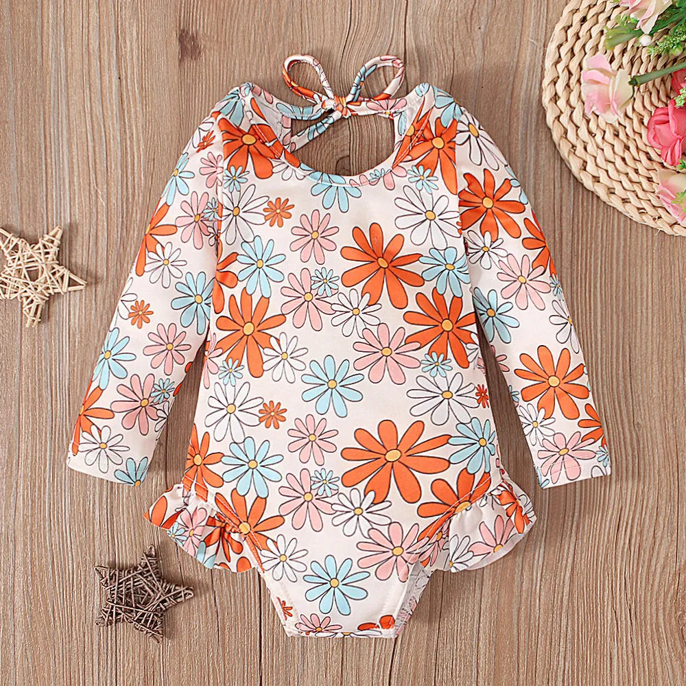 Girl's floral pattern open back swimsuit in orange red, available in sizes 70 to 110 yards.
