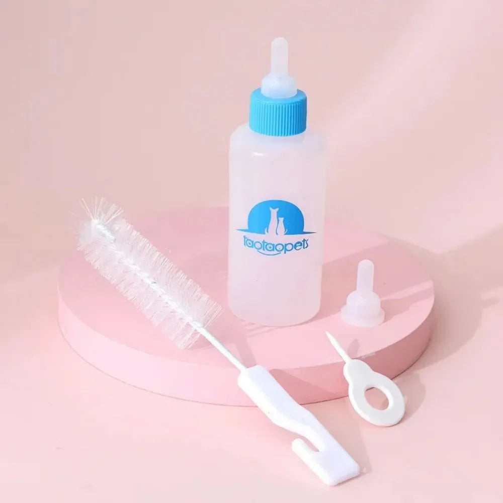 Set of four coloured pet milk bottle feeders with silicone teats and a cleaning brush for small animals.