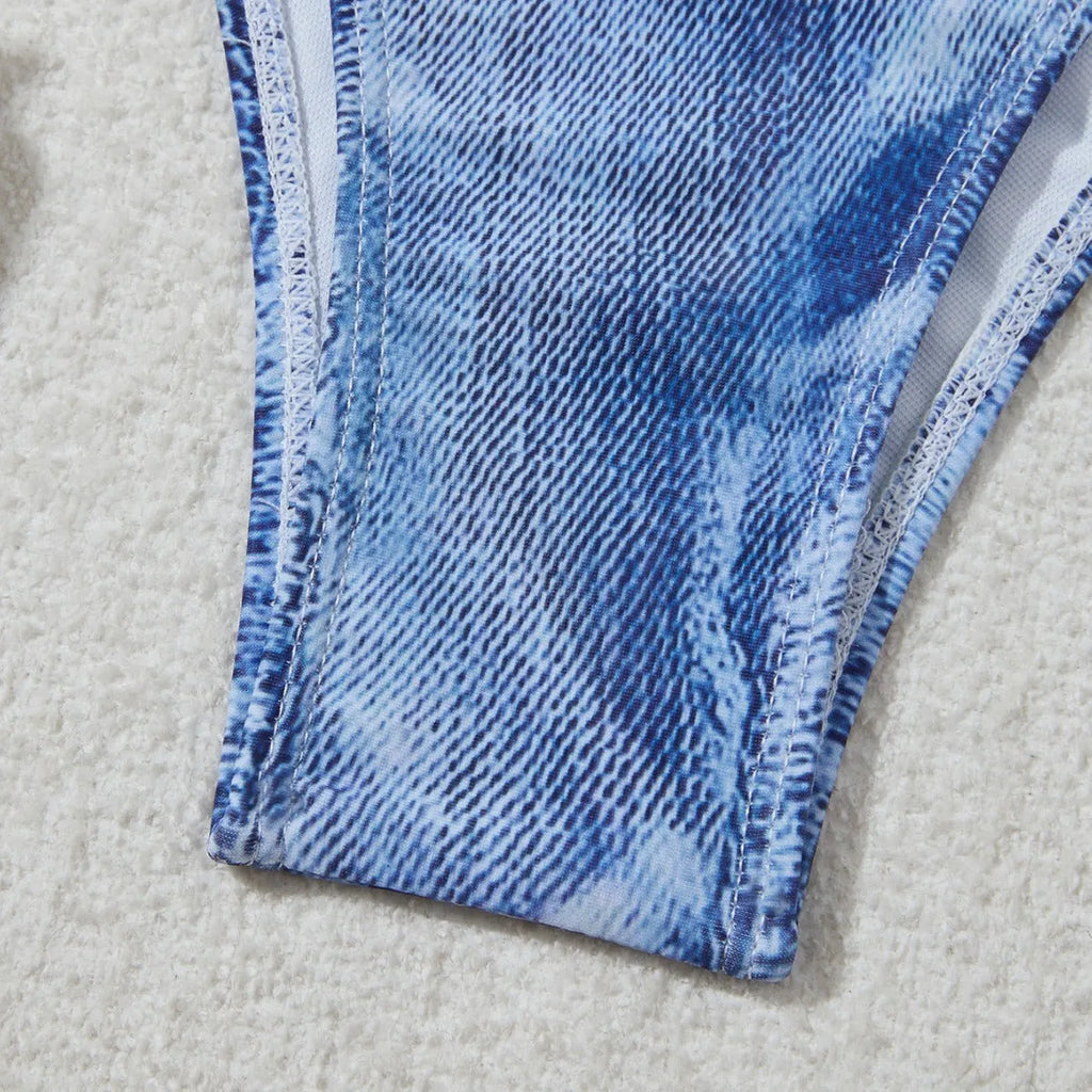 Denim blue printed women's bikini set with strap design, shown on a model.
