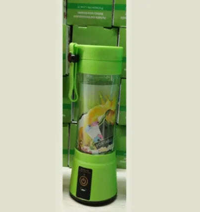 Pink portable USB blender with six blades and a 380ml transparent cup on a table