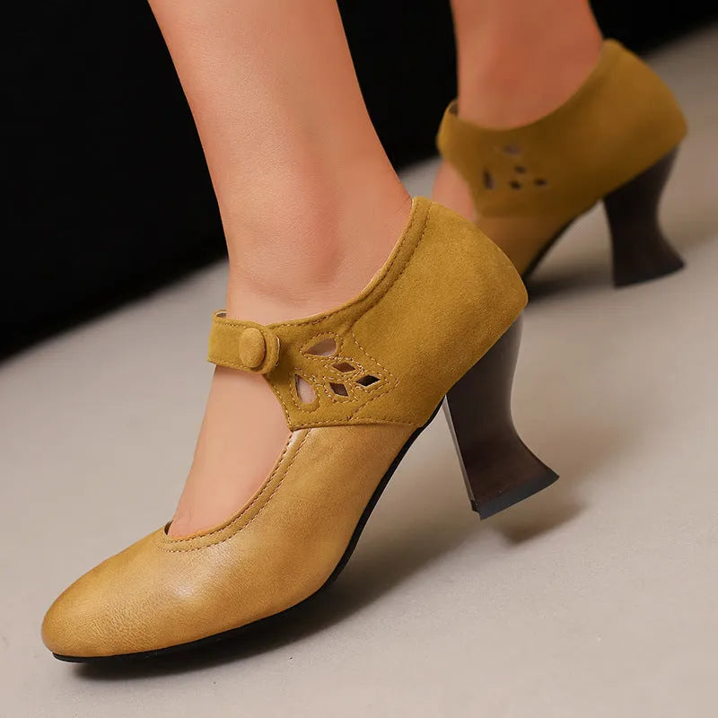 Women's round toe buckle shoes with chunky heel and rubber sole, black colour, low top design