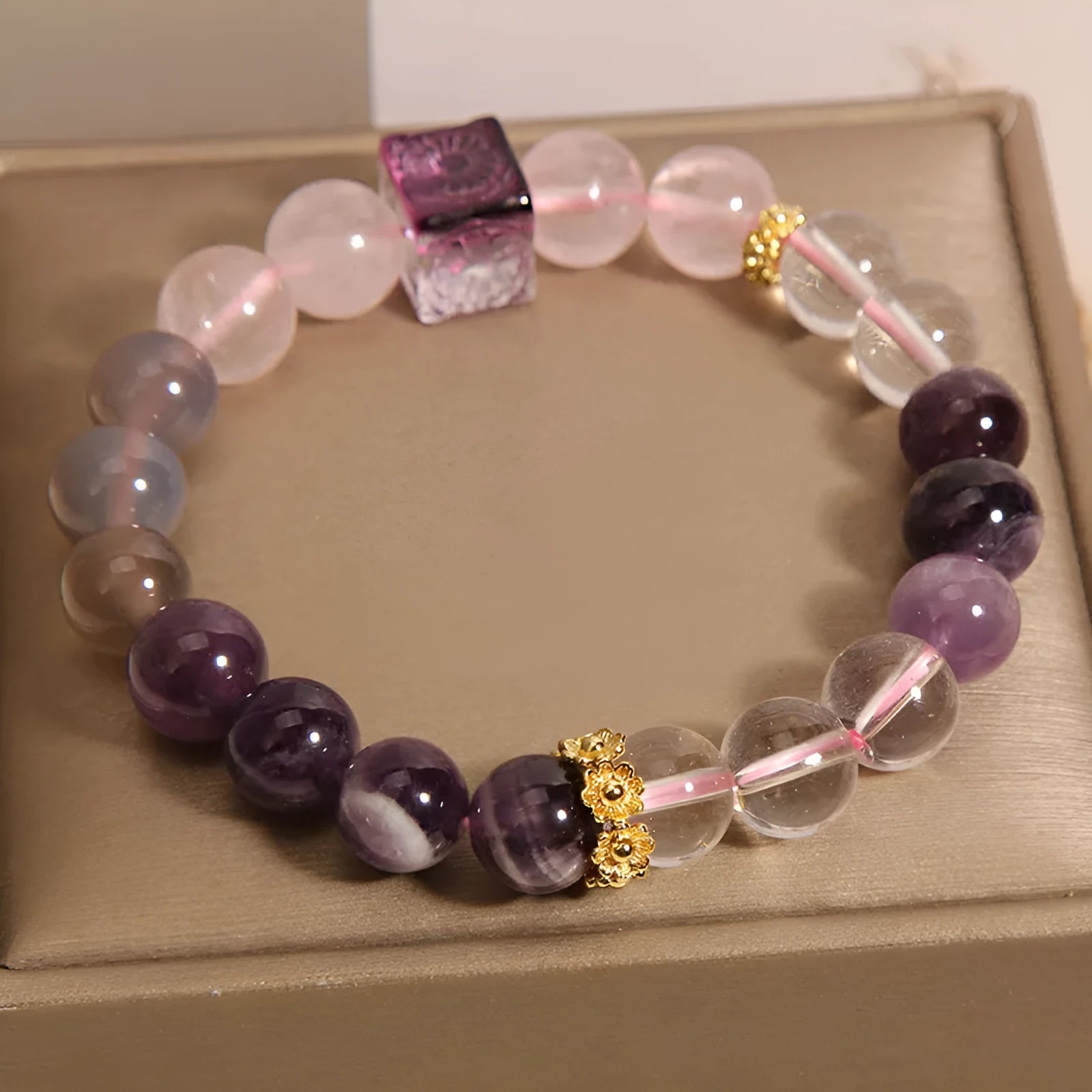 Purple women's bracelet with natural amethyst stones and crystal rhinestone design, measuring 10mm.