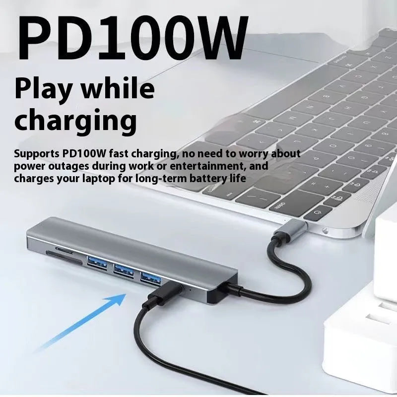 A compact 7-in-1 USB-C expansion dock with a 15cm cable, featuring HDMI and USB ports.