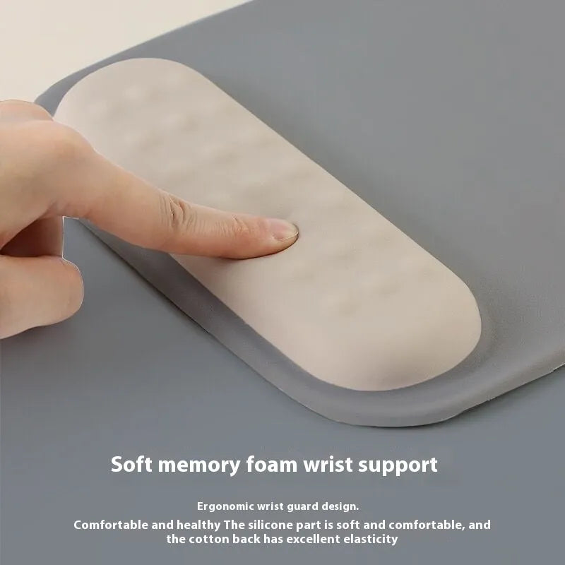 Ergonomic cloth silicone mouse pad with integrated wrist rest in multiple colour options.