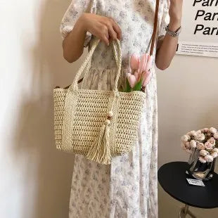 Women's woven straw crossbody bag in milky white with polyester lining and shoulder strap