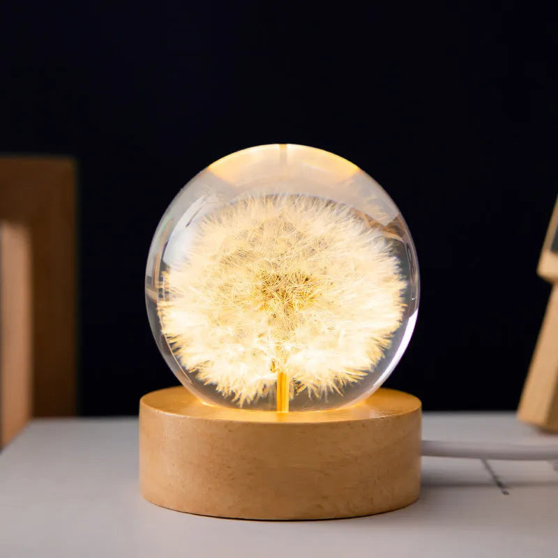 Luminous 3D dandelion crystal ball night light on a beech wood stand