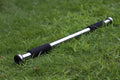 Steel adjustable indoor pull-up bar extended for door frame fitness training.