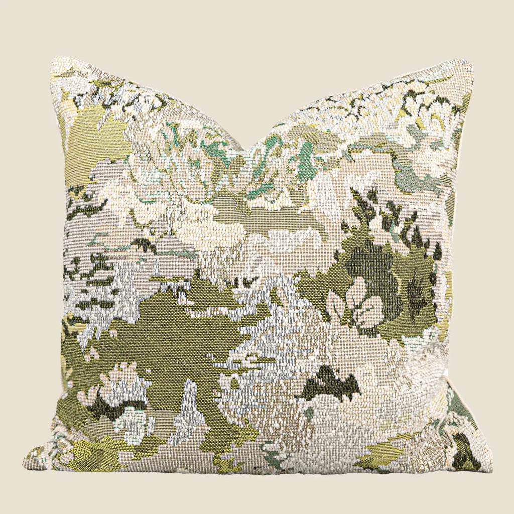 Green wool blend cushion cover with a spring flowers botanical pattern, shown in square and lumbar sizes.
