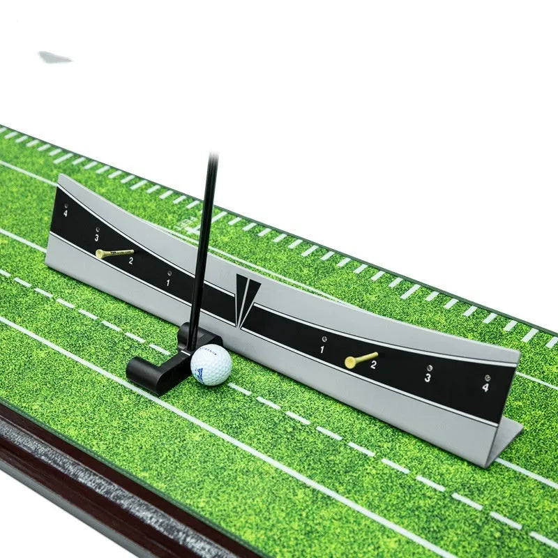 Close-up of an adjustable PVC golf putter trajectory balance simulator on a flat surface.