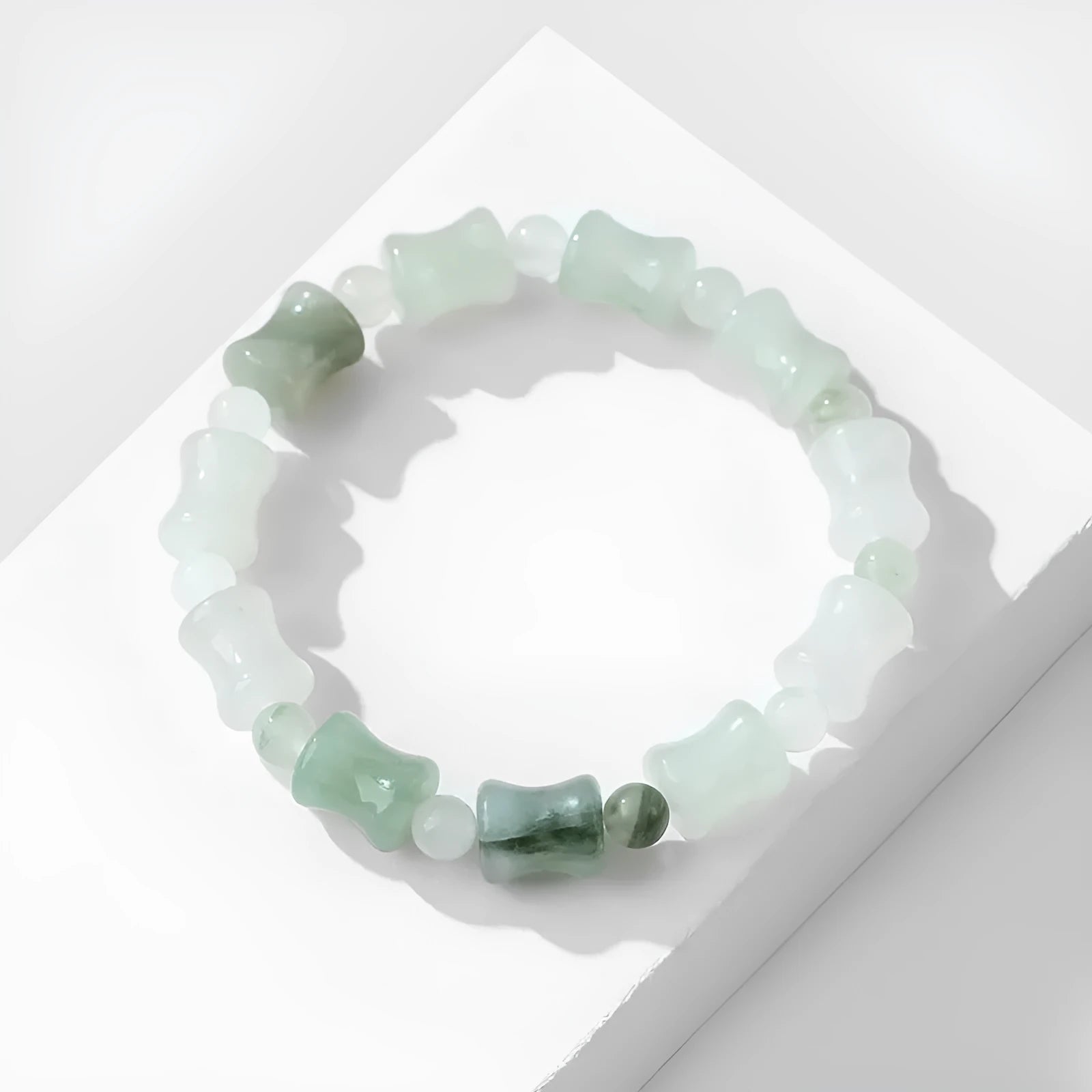 Korean style beaded bracelet with diamond shaped chalcedony and coconut shell beads on an elastic cord.