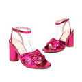Plus size women's peep toe ankle strap sandals with a buckle in gold, on a white background.