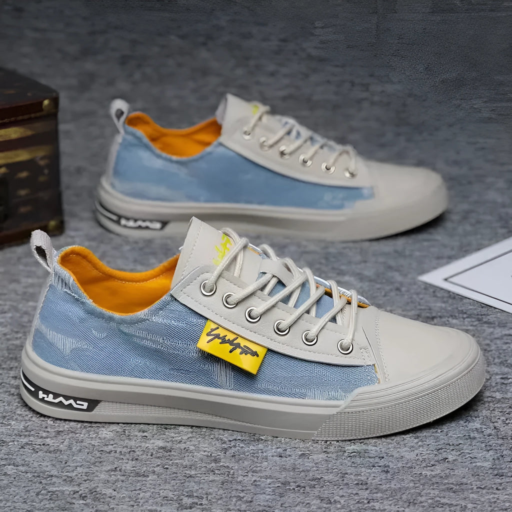 A pair of men's casual canvas lace-up shoes with a round toe and rubber sole.