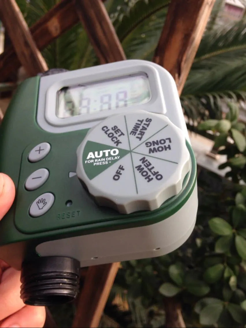 Green digital programmable garden hose water timer with large display and two outlet ports