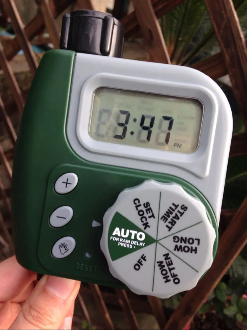 Green digital programmable garden hose water timer with large display and two outlet ports
