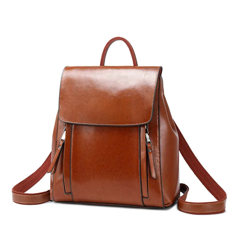 Large black genuine leather women's backpack with multiple pockets and double shoulder straps.
