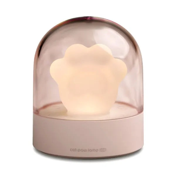 Cute grey or pink cat paw shaped USB rechargeable night light with music box on a desk.