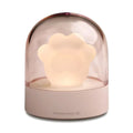 Cute grey or pink cat paw shaped USB rechargeable night light with music box on a desk.