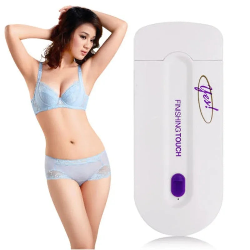 White rechargeable electric hair removal instrument with foil head and cleaning brush on a table.