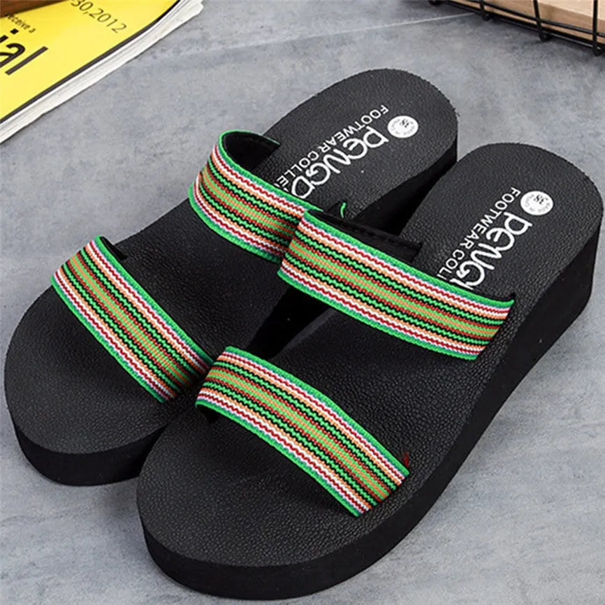Women's brown bohemian slippers with an adjustable woven strap and a raised rubber sole.