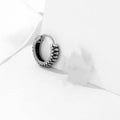 Silver geometric retro twist earrings made from stainless steel with a striped pattern.