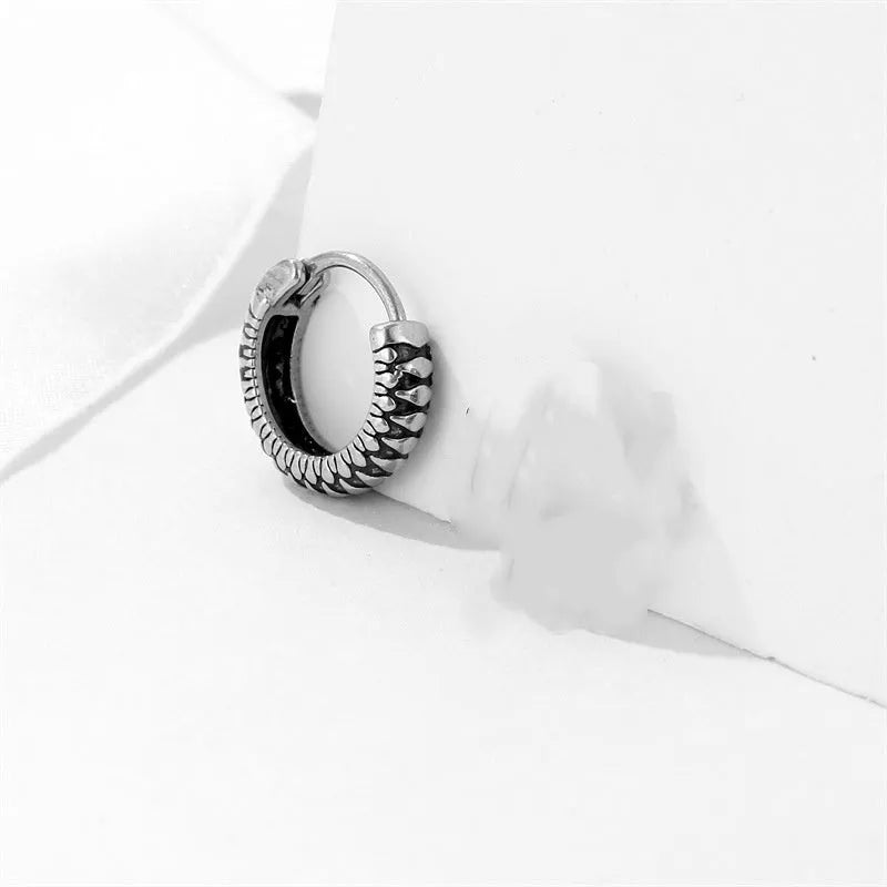 Silver geometric retro twist earrings made from stainless steel with a striped pattern.