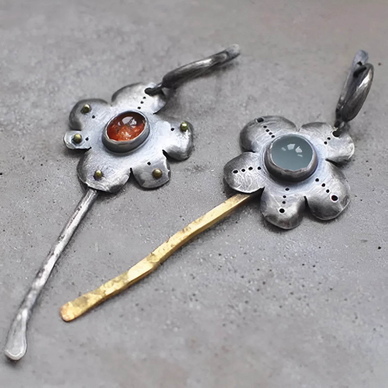 A pair of long retro earrings with asymmetric geometric flower shapes in a two-tone electroplated finish.