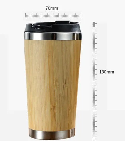 Bamboo travel coffee cup with thermal insulation, leak-proof lid, and 420ml capacity on foam pad