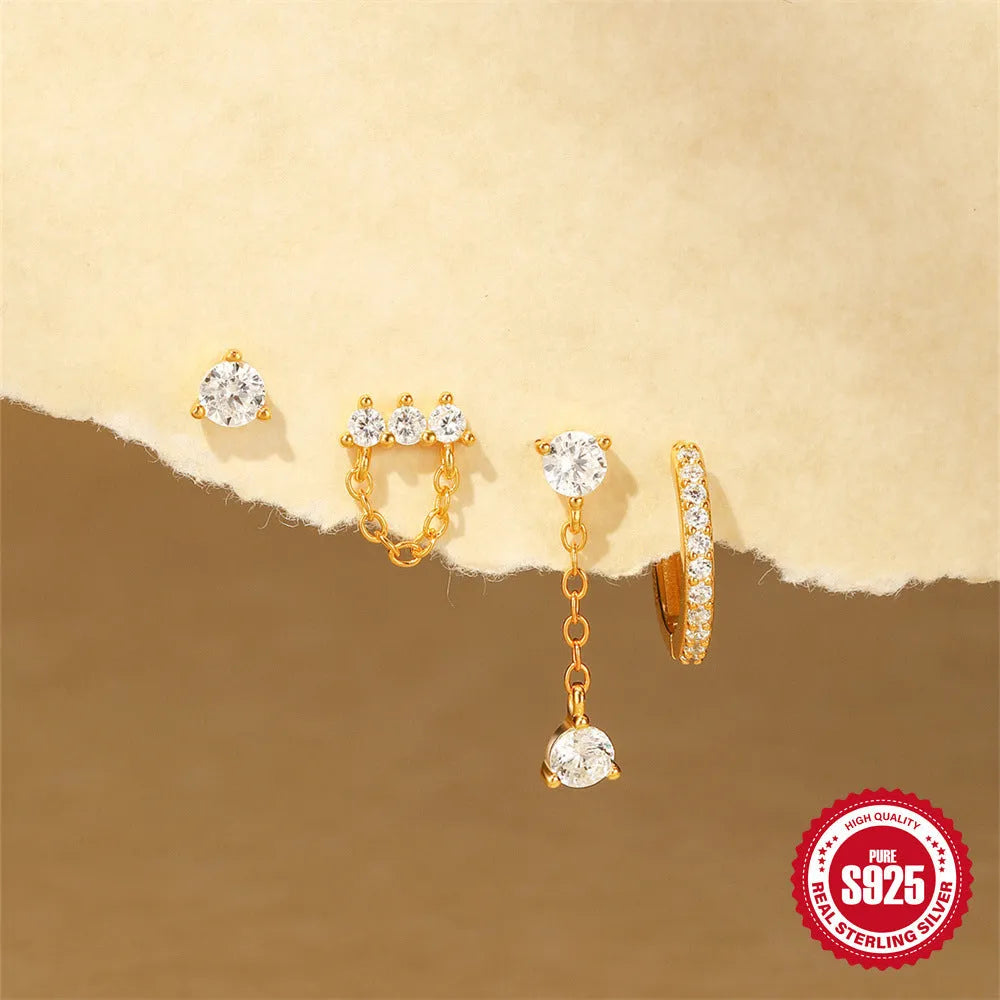 A pair of S925 sterling silver earrings with a geometric clover petal design and an electroplated gold finish.