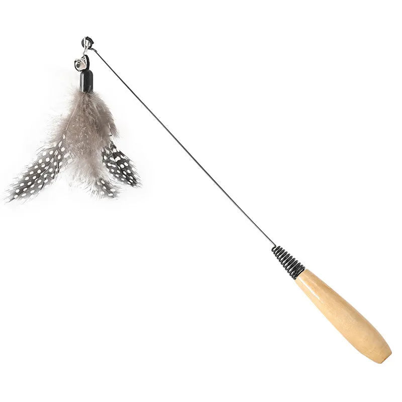 Wooden handle cat teasing stick with attached feather bell toy and three spare replacement heads.
