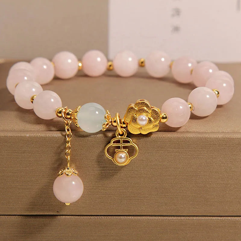 Women's pink crystal flower bracelet with refined graceful design on wrist