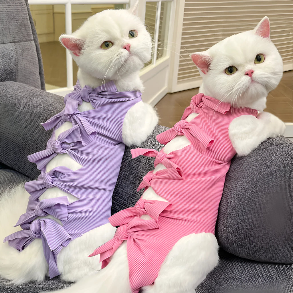 Lace-up polyester recovery clothing for a cat, shown in a choice of colours including blue, pink, and green pineapple.