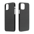 Dull black Kevlar iPhone case with volcanic crater texture next to a MagSafe charger.