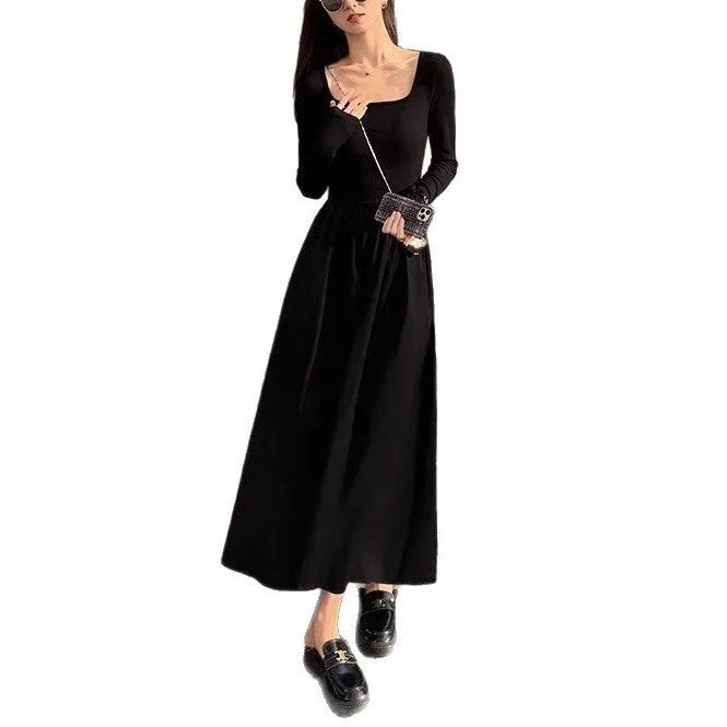 Women's black square collar knitted dress with long sleeves, elastic waist, and A-line long skirt.