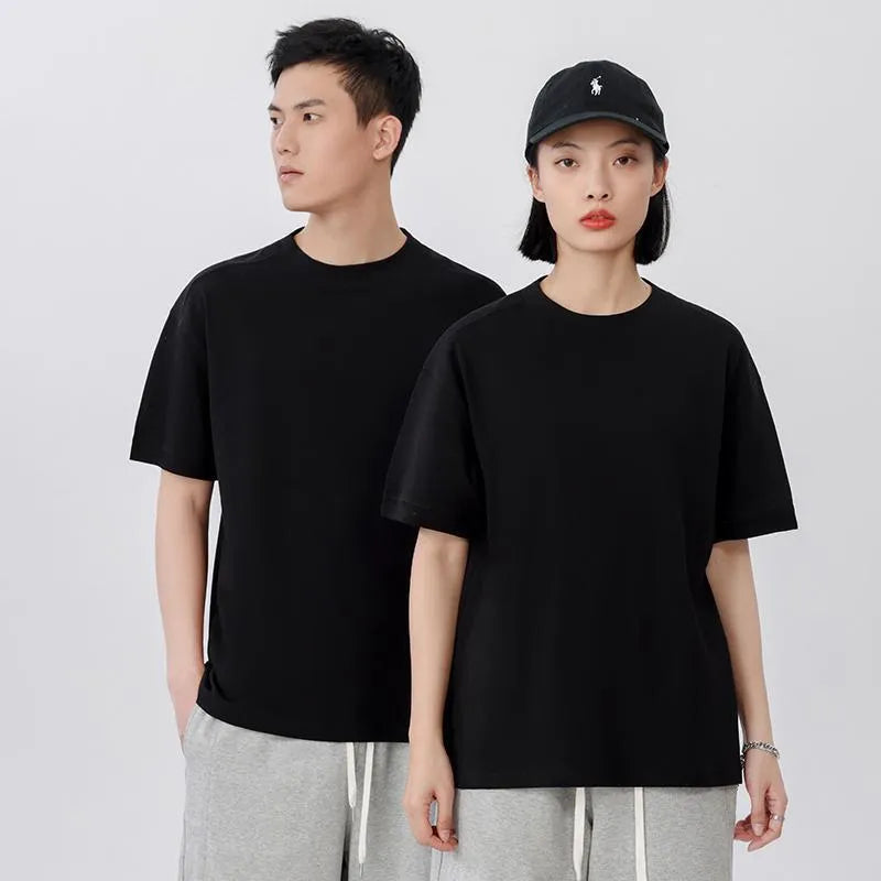 Men's loose-fit short-sleeved cotton pique t-shirt on a hanger, shown in a solid colour.