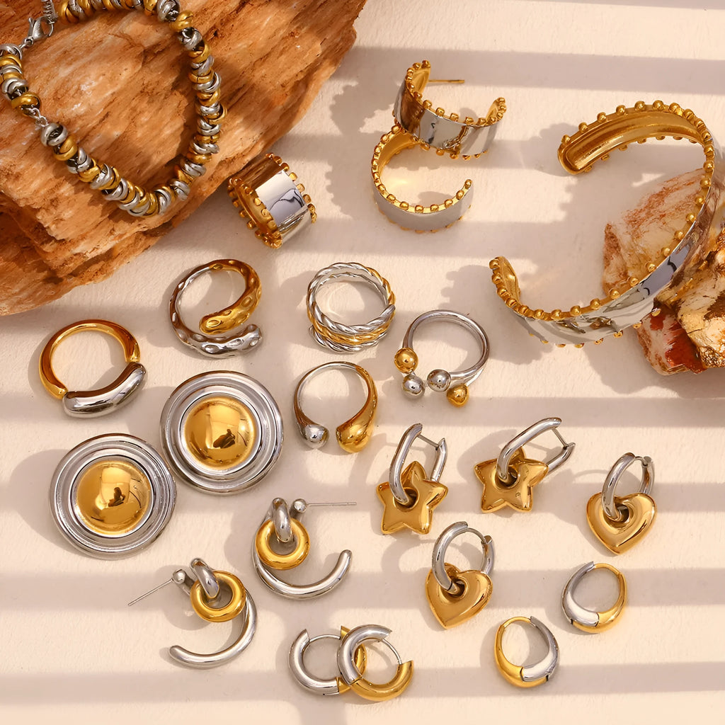 Gold electroplated geometric stainless steel earrings, bracelet, and necklace set for women.