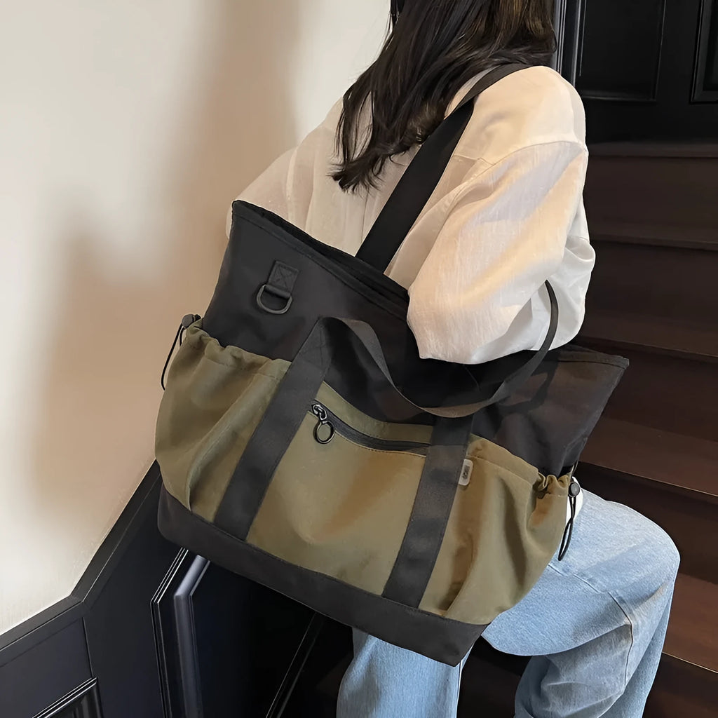 Women's lightweight oxford cloth travel bag in grey, black or green with 36-55L capacity